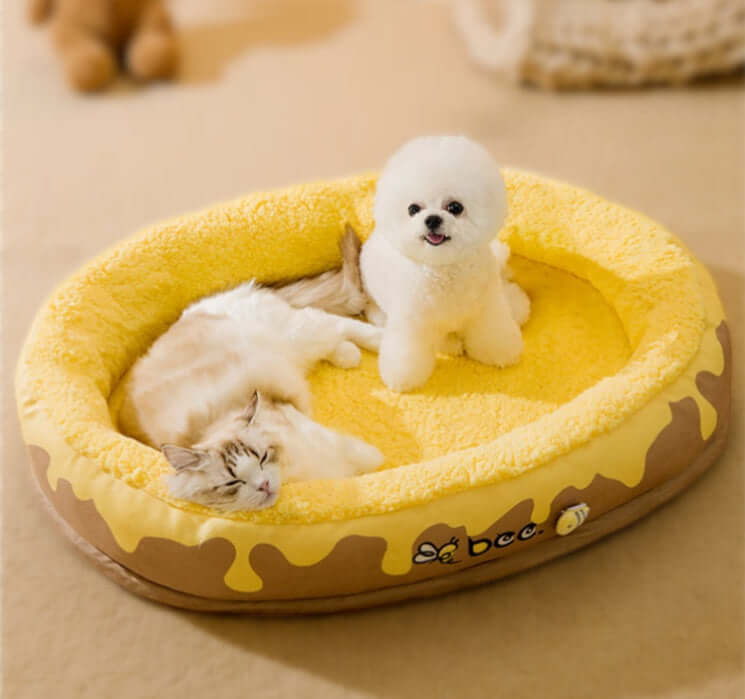 Zenvra washable four seasons pet bed for dogs and cats, showing a cozy, cushioned bed with a soft fabric cover in neutral colors.