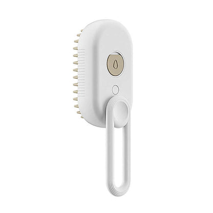 Zenvra electric steam pet grooming brush with hair removal comb showing a close-up of the handheld device and bristle head.