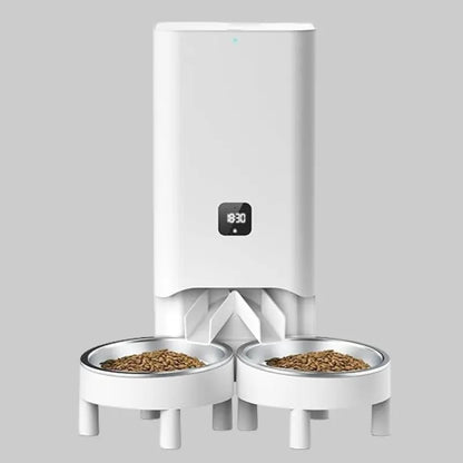 Zenvra smart automatic pet feeder with timed portion control, featuring digital display and food dispensing tray for pets.