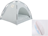 Cat cooling mat for pets inside a soft pet tent with a grooming brush beside it.