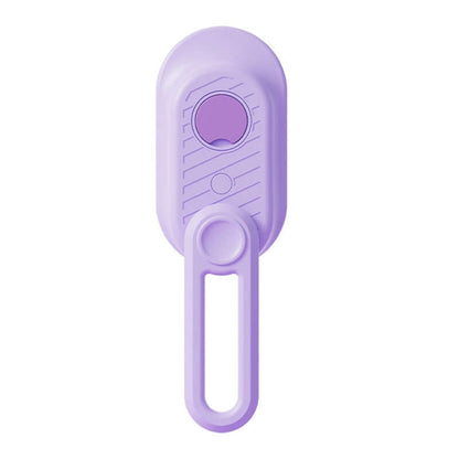 Zenvra electric steam pet grooming brush with hair removal comb, showing the device and cleaning surface in use.